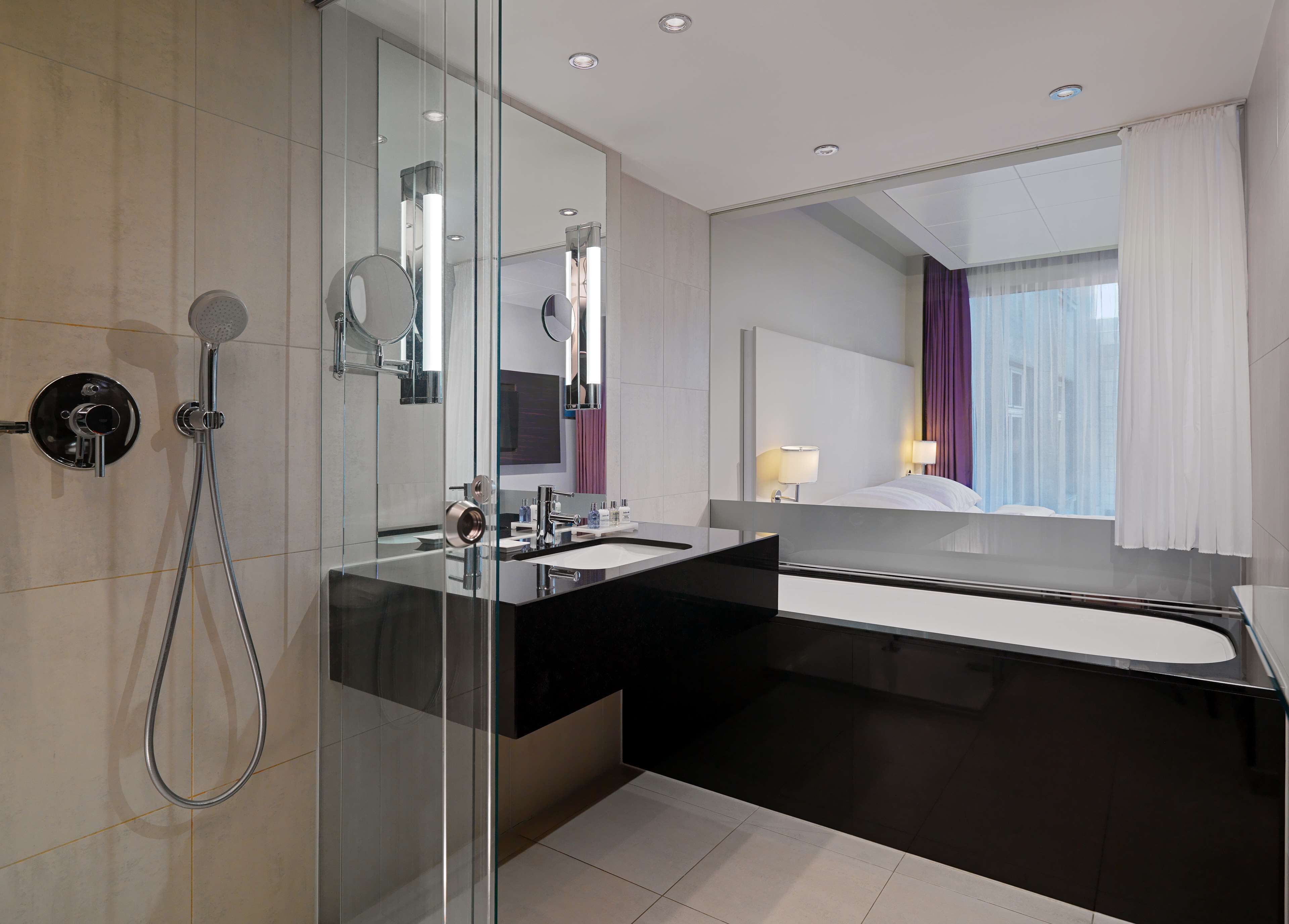 rainfall showerhead, eco-friendly toiletries, hair dryer, towels