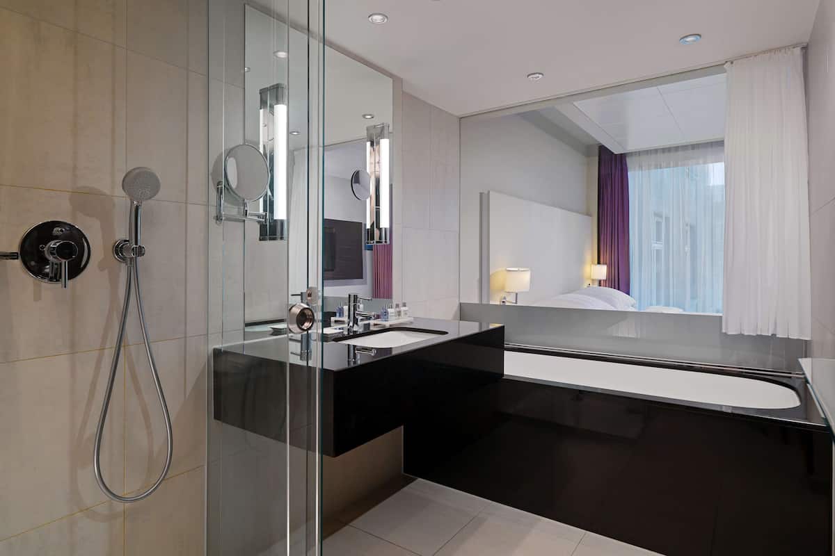 rainfall showerhead, eco-friendly toiletries, hair dryer, towels