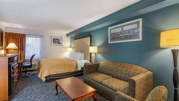 Desk, laptop workspace, blackout drapes, iron/ironing board