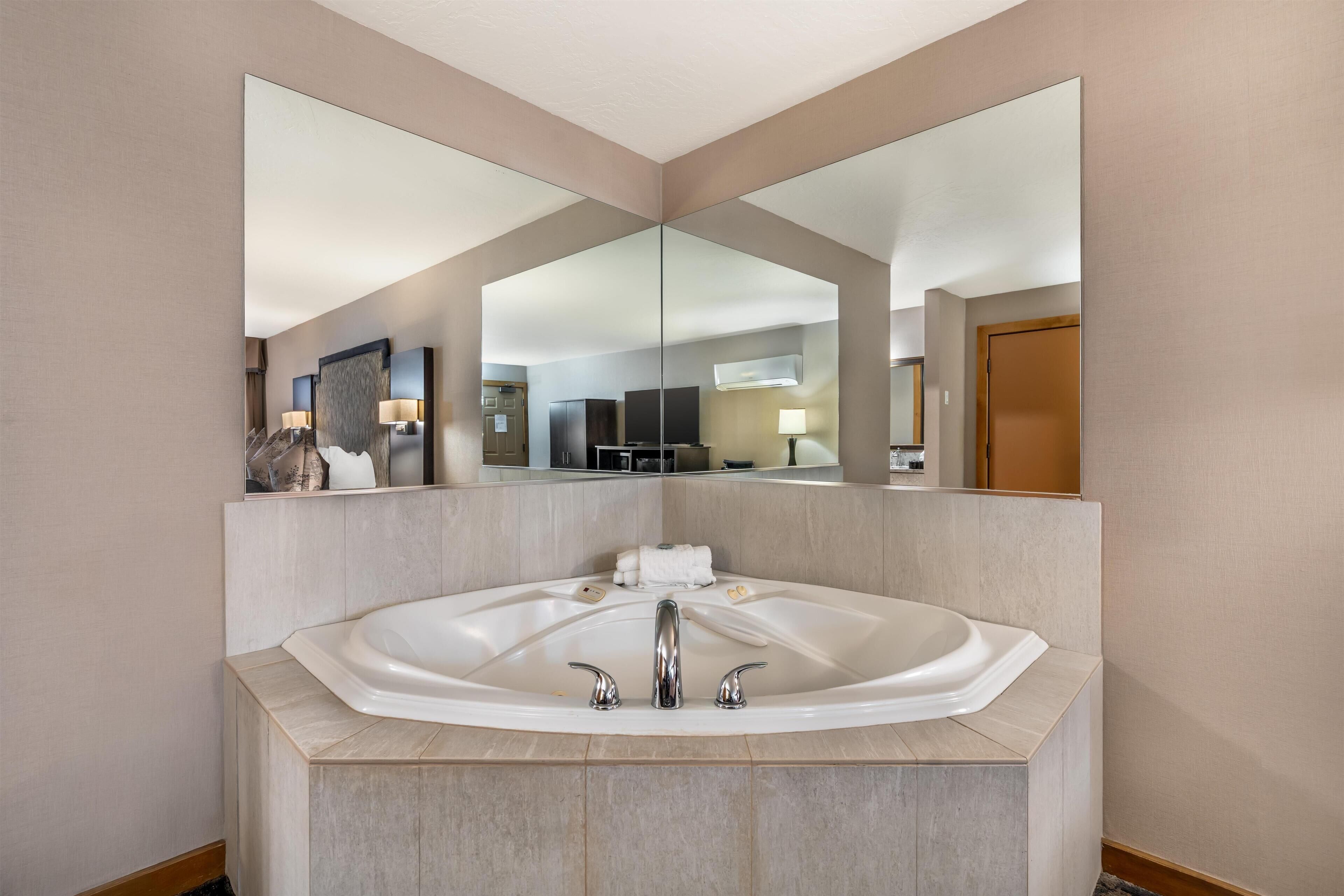 Suite, 1 King Bed, Non Smoking, Jetted Tub | Desk, laptop workspace, blackout drapes, iron/ironing board