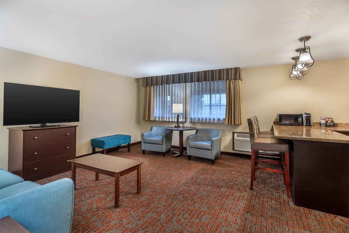 Suite, 1 King Bed, Non Smoking, Refrigerator & Microwave | Desk, laptop workspace, blackout drapes, iron/ironing board