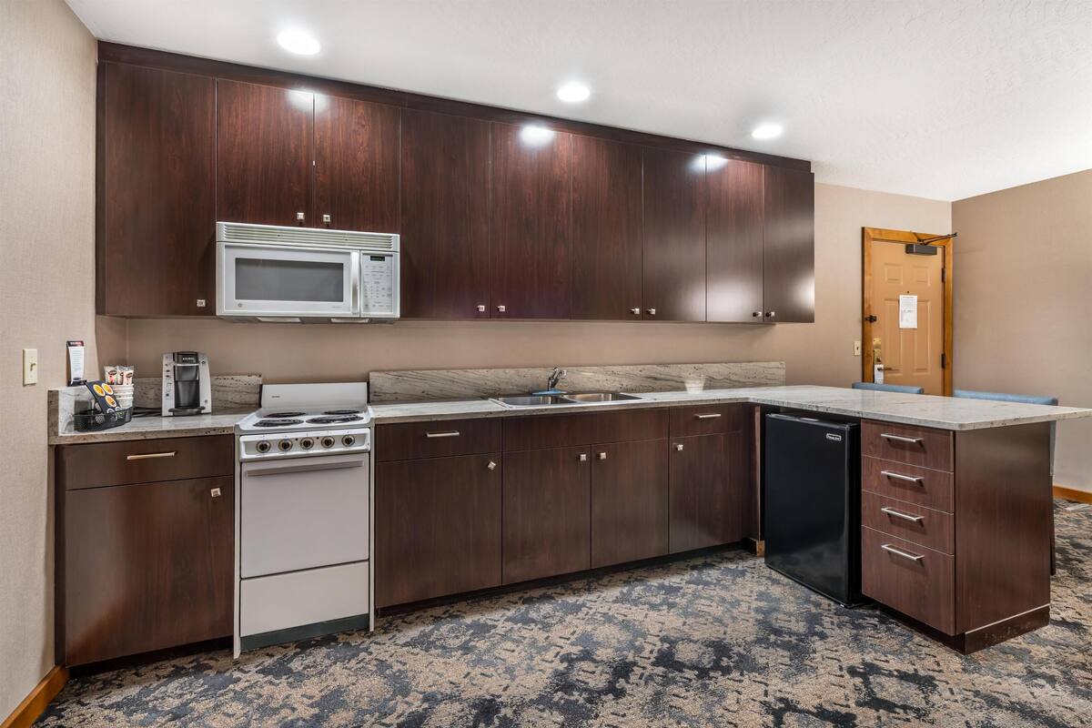 Suite, 1 King Bed, Non Smoking, Kitchen | Desk, laptop workspace, blackout curtains, iron/ironing board