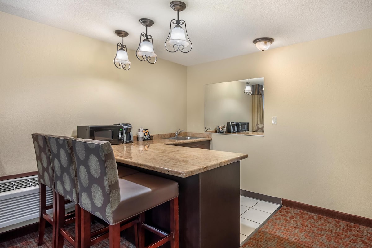 Suite, 1 King Bed, Non Smoking, Refrigerator & Microwave | Desk, laptop workspace, blackout drapes, iron/ironing board