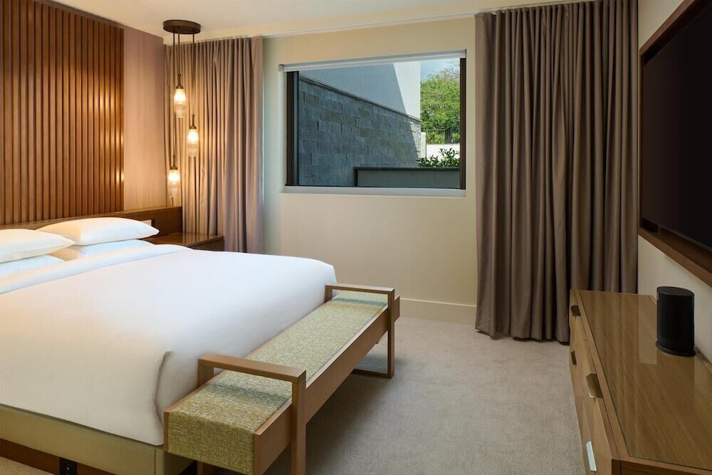 Premium bedding, down comforters, free minibar items, in-room safe