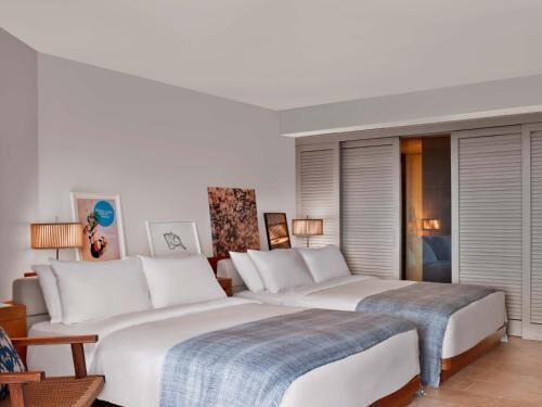 Premium bedding, down comforters, free minibar items, in-room safe