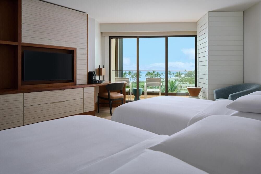 Premium bedding, down comforters, free minibar items, in-room safe