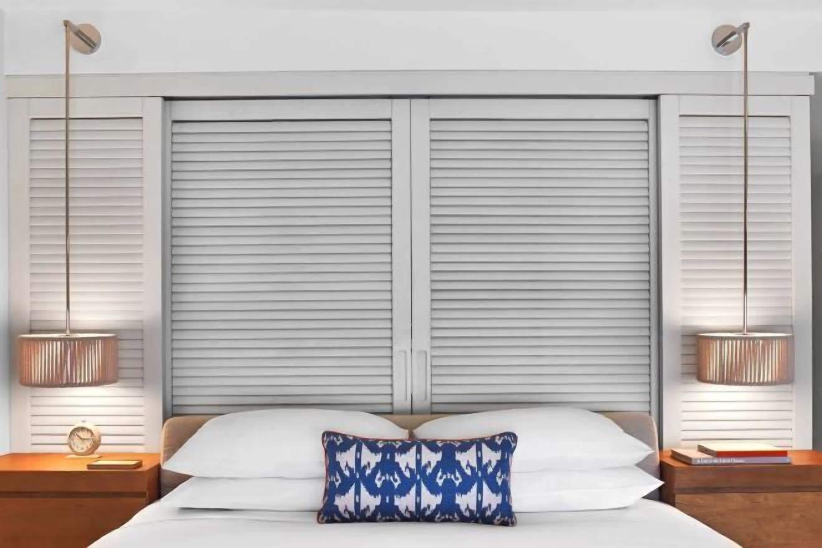 Premium bedding, down comforters, free minibar items, in-room safe