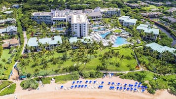 On the beach, white sand, sun loungers, beach umbrellas