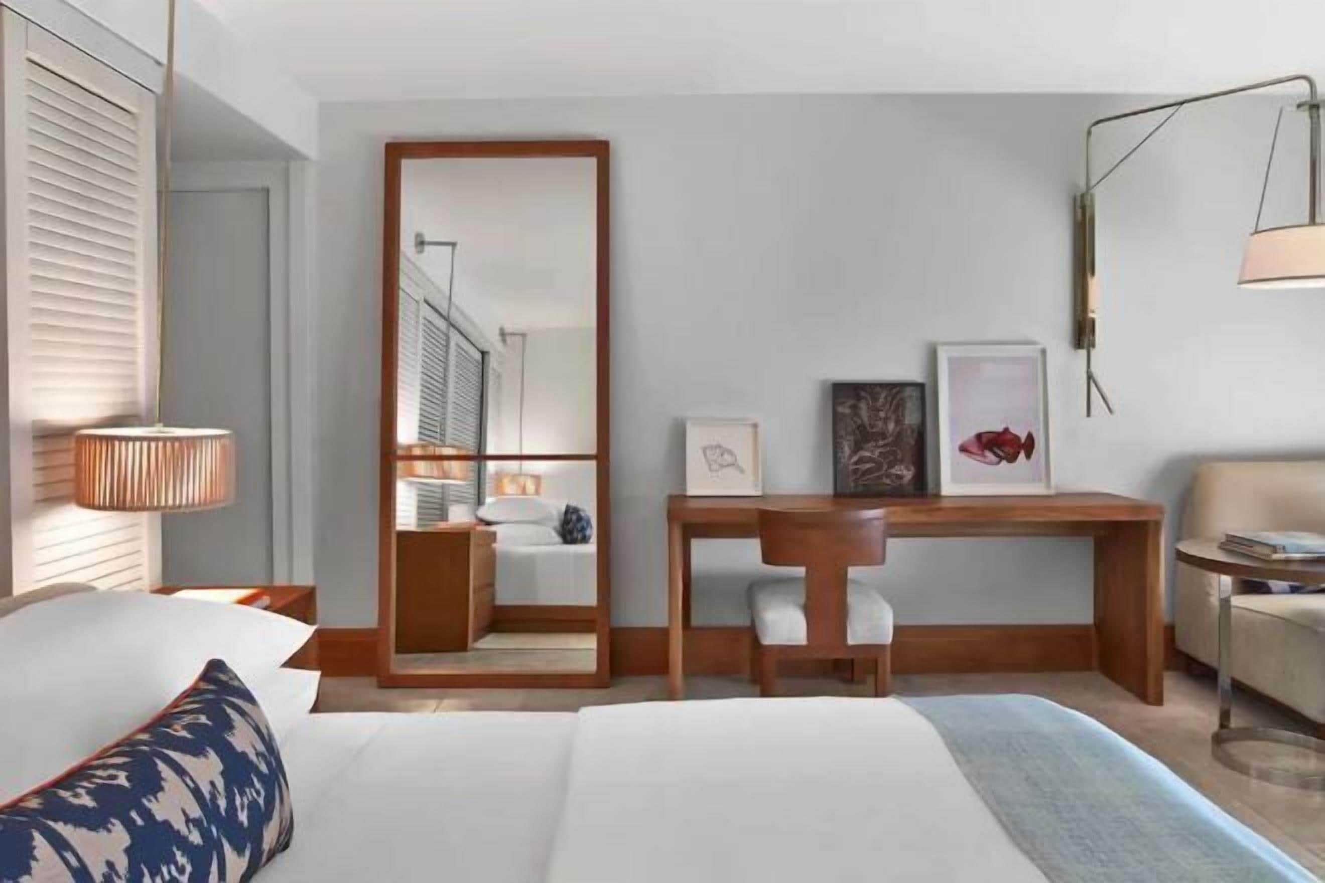 Premium bedding, down comforters, free minibar items, in-room safe