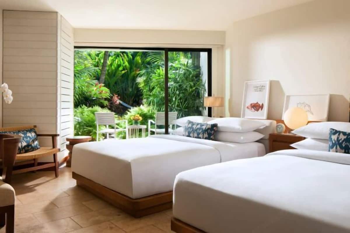 Premium bedding, down comforters, free minibar items, in-room safe