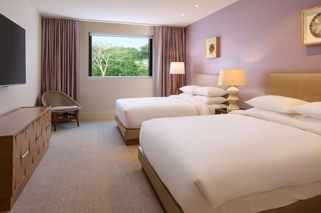 Premium bedding, down comforters, free minibar items, in-room safe