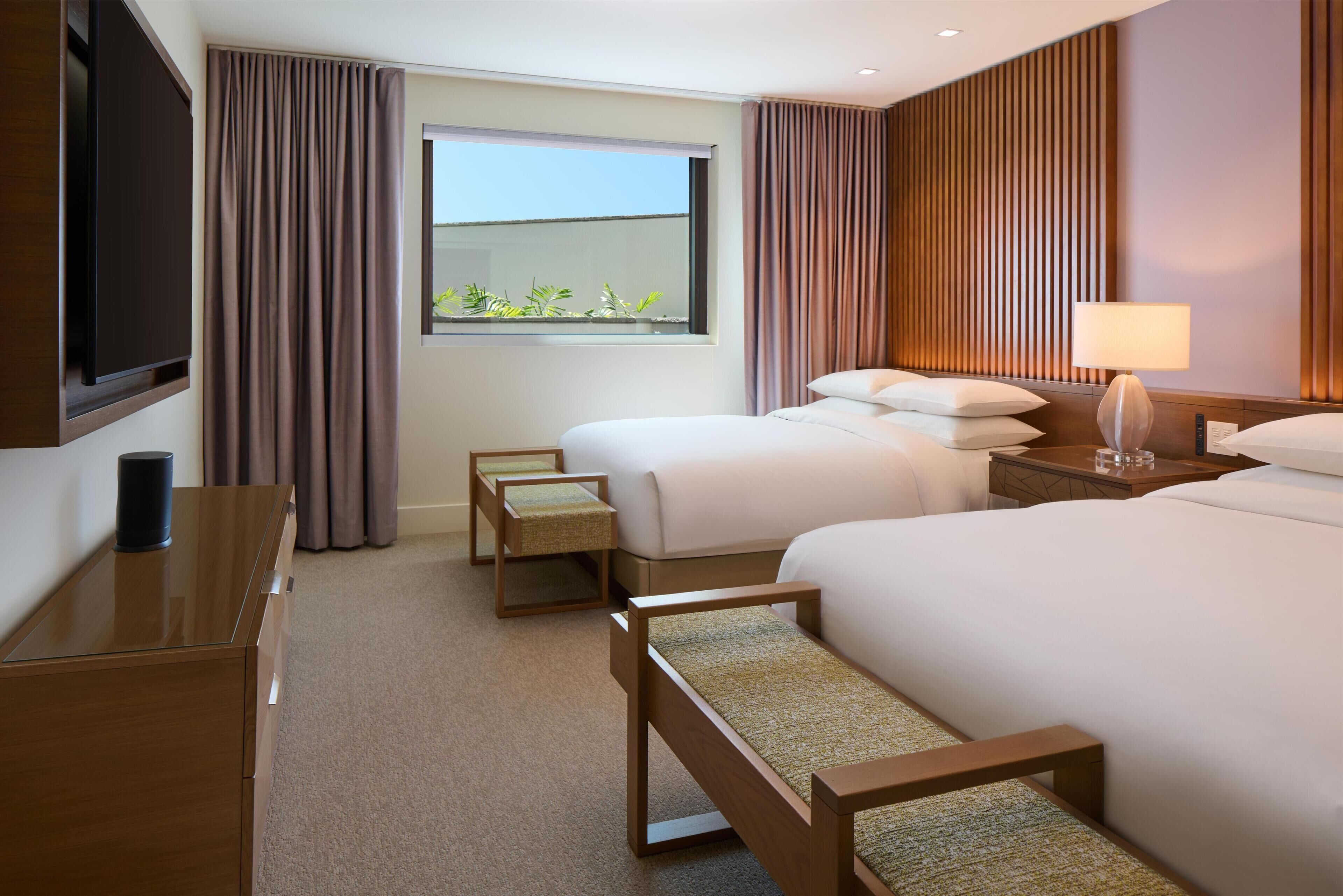 Premium bedding, down comforters, free minibar items, in-room safe