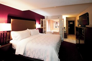 Suite, 1 cama King size, hidromasaje | 1 habitación, ropa de cama de alta calidad, escritorio y insonorización 