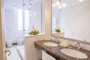 Eco-friendly toiletries, hair dryer, slippers, bidet