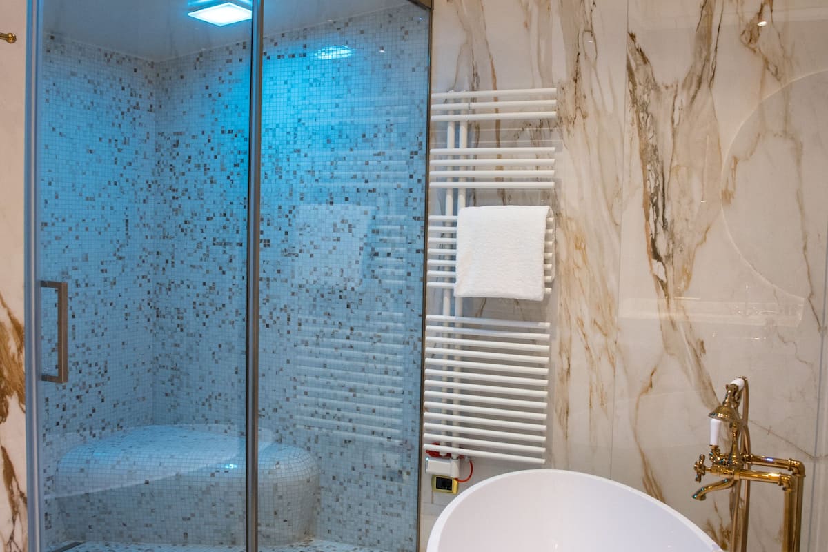 presidential suite | bathroom | eco-friendly toiletries, hair dryer, slippers, bidet