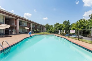 Seasonal outdoor pool, open 9:00 AM to 10:00 PM, pool loungers