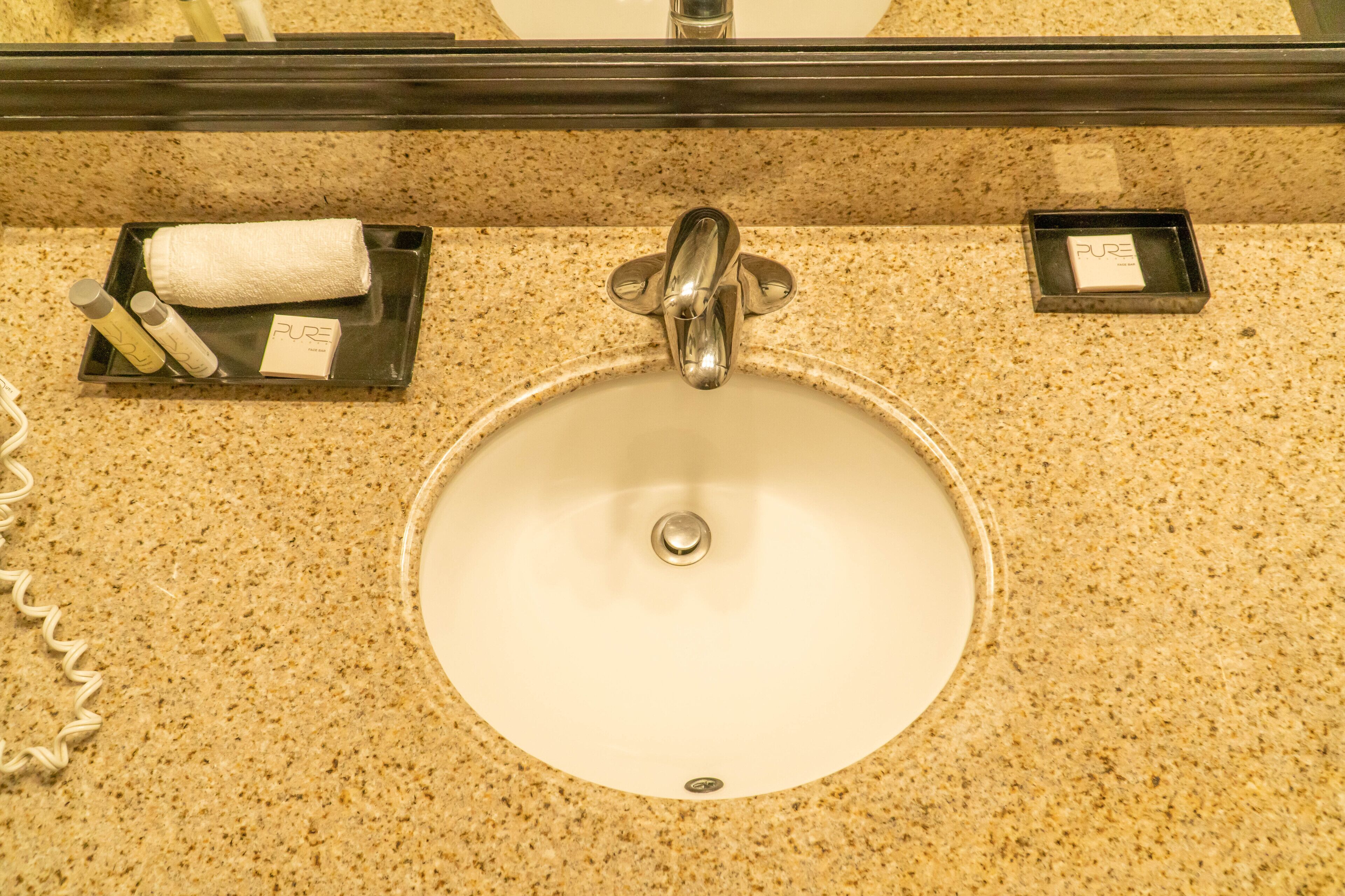 eco-friendly toiletries, hair dryer, towels