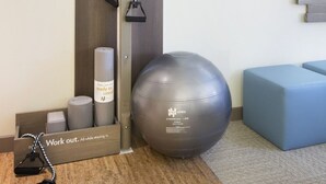 A fitness area with a pull-up bar, exercise ball, and resistance bands. - EVEN Hotel Norwalk by IHG (Norwalk)
