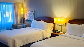 Premium bedding, desk, laptop workspace, blackout curtains