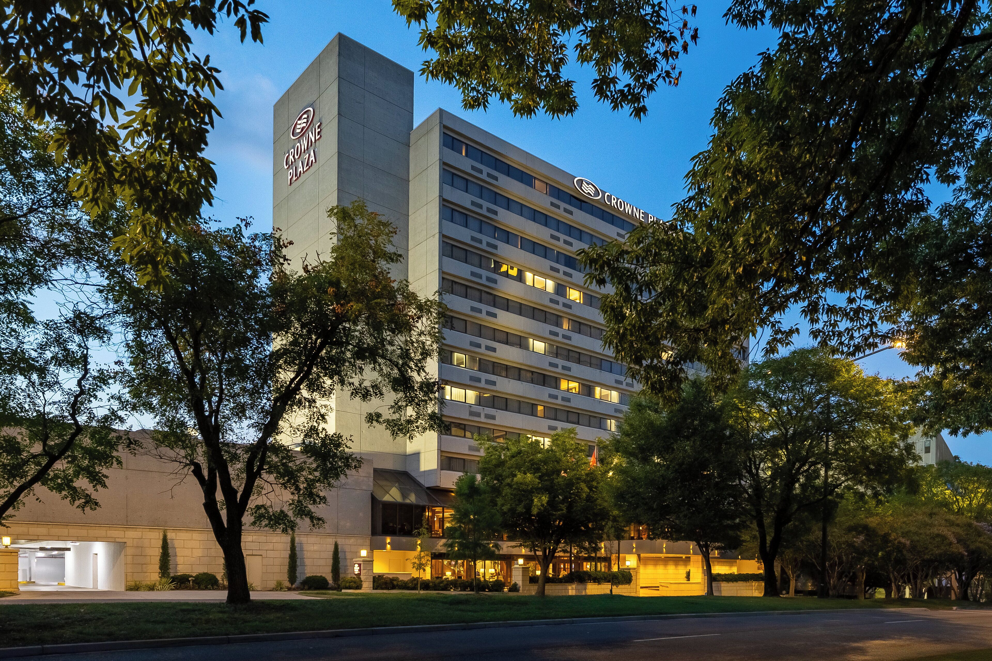 A multi-story hotel with a prominent sign reading "Crowne Plaza" at the top.