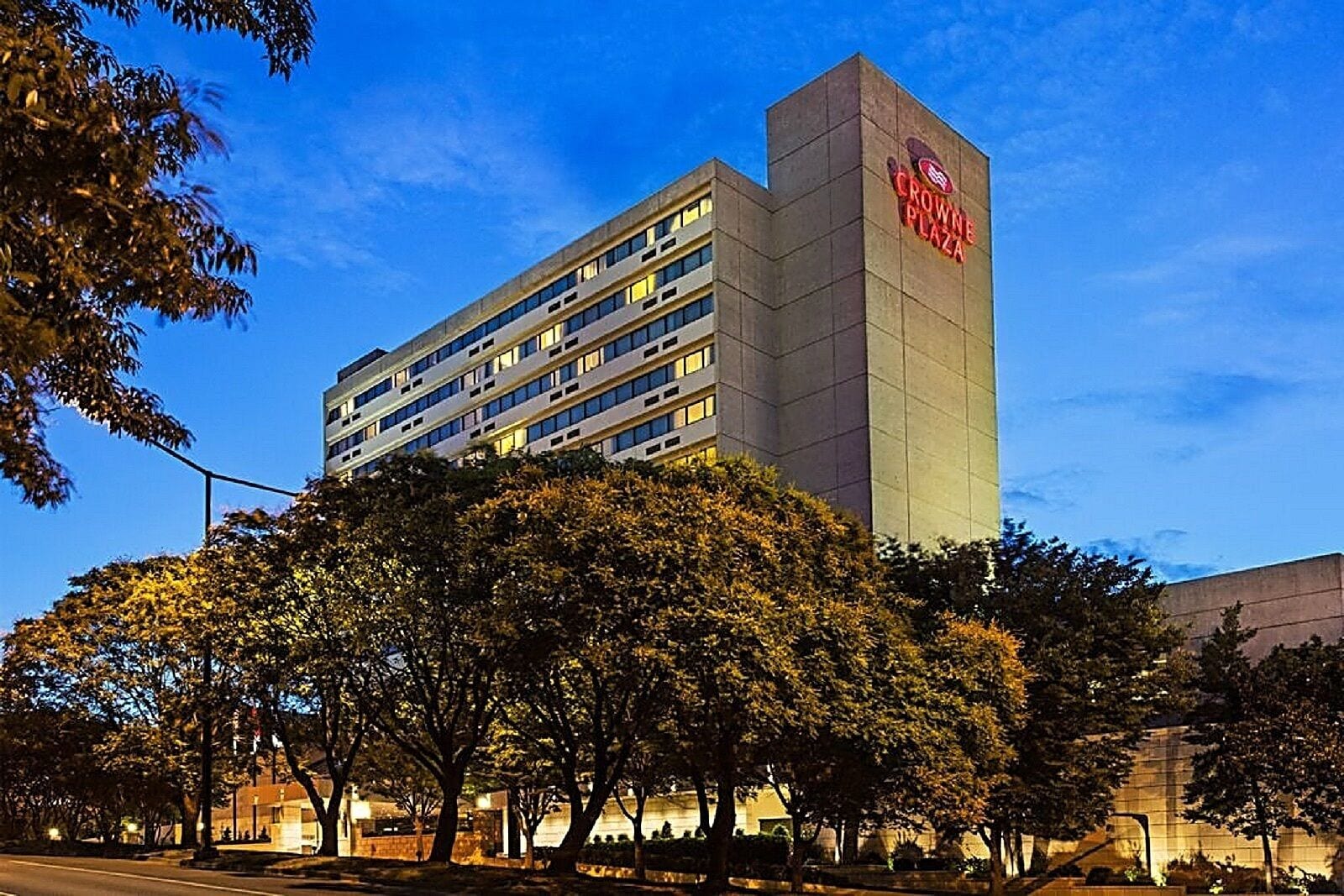 A multi-story hotel with a prominent sign reading "Crowne Plaza".