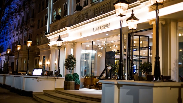 A hotel entrance with a grand facade, steps leading up to the entrance, and a sign reading "Blakemore." - Blakemore Hyde Park (London)