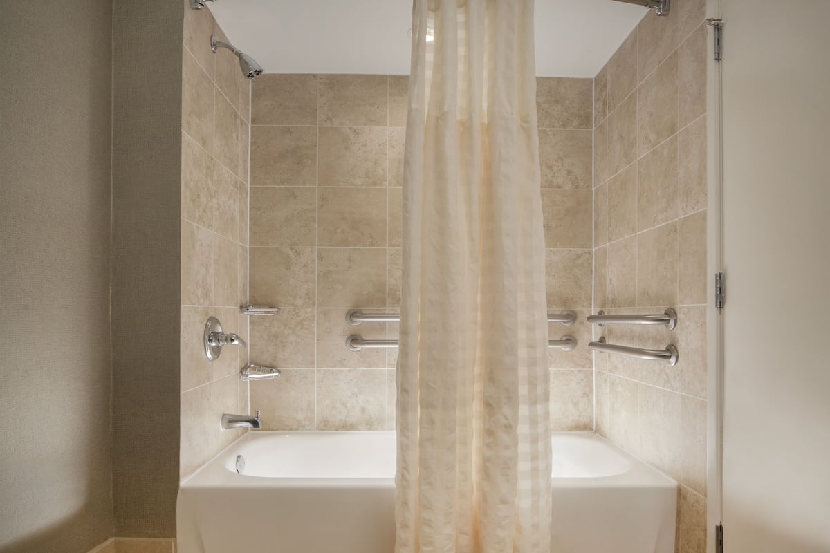 suite, 1 king bed, accessible, bathtub | bathroom | designer toiletries, hair dryer, towels