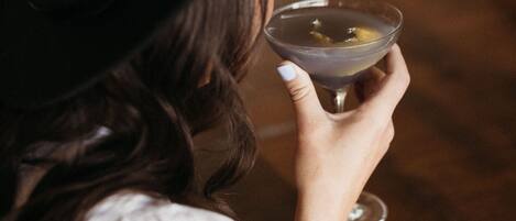 A person holding a martini glass.