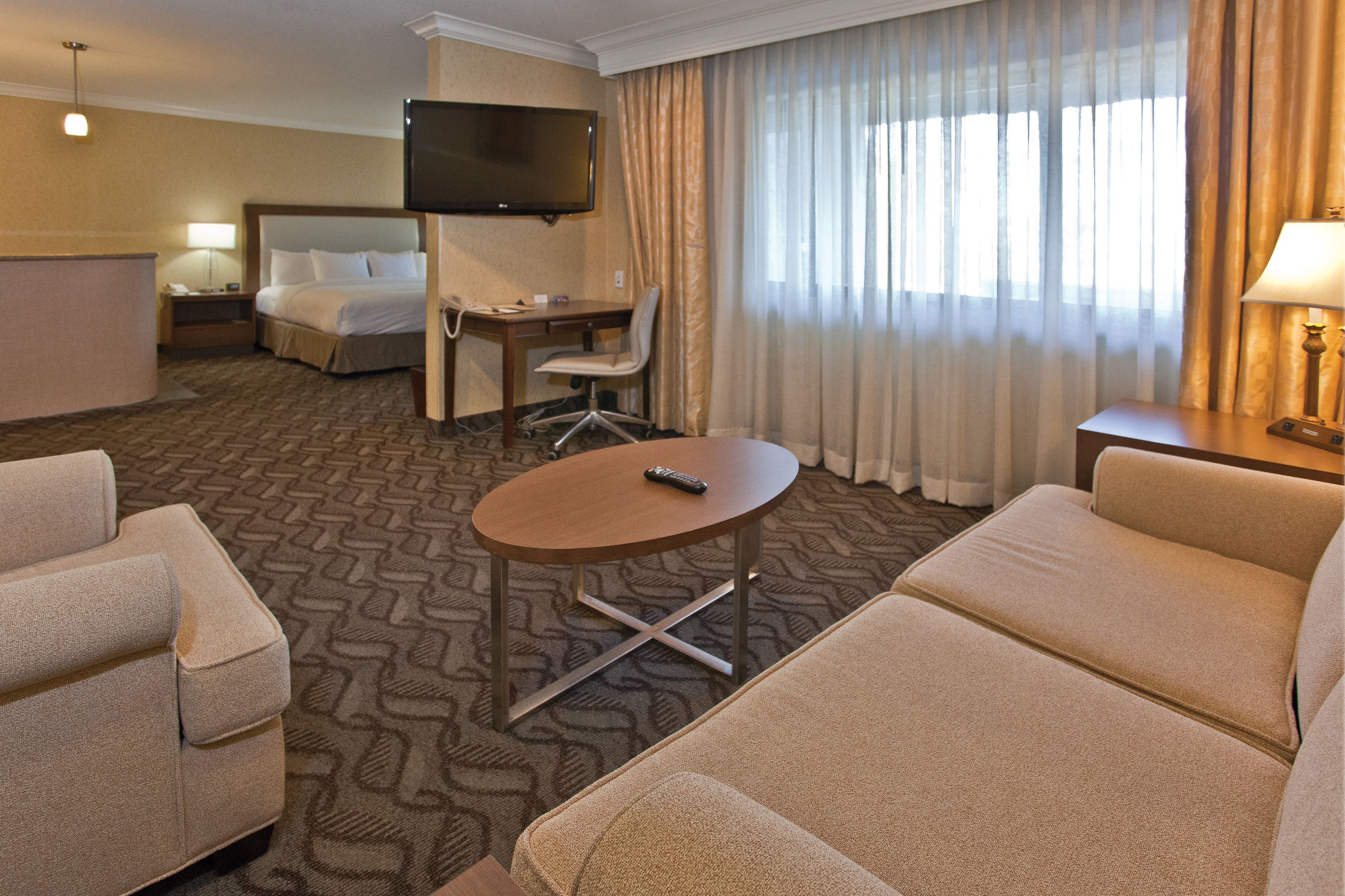 suite, 1 king bed, non smoking | hypo-allergenic bedding, in-room safe, desk, blackout curtains