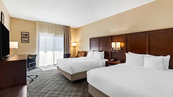 Premium bedding, pillow-top beds, desk, laptop workspace