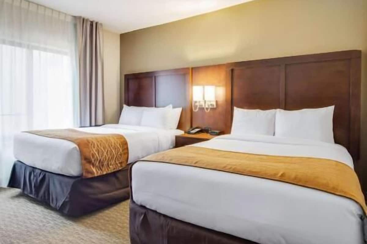 Premium bedding, pillowtop beds, desk, laptop workspace