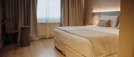 Junior Suite | 1 bedroom, premium bedding, minibar, in-room safe