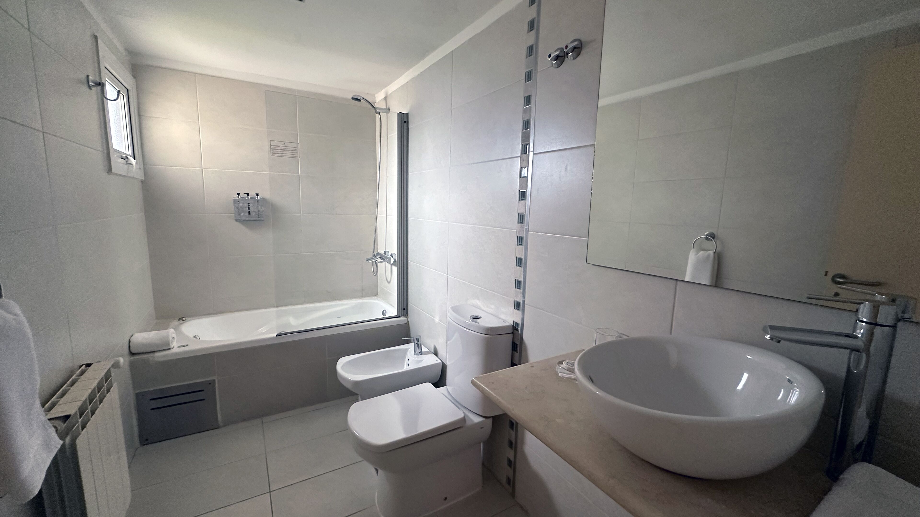 junior suite | bathroom | bathtub, deep-soaking bathtub, eco-friendly toiletries, hair dryer