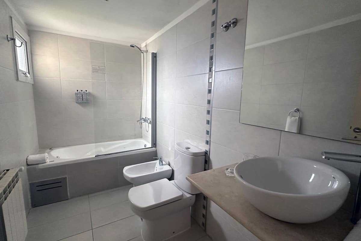 junior suite | bathroom | bathtub, deep-soaking bathtub, eco-friendly toiletries, hair dryer