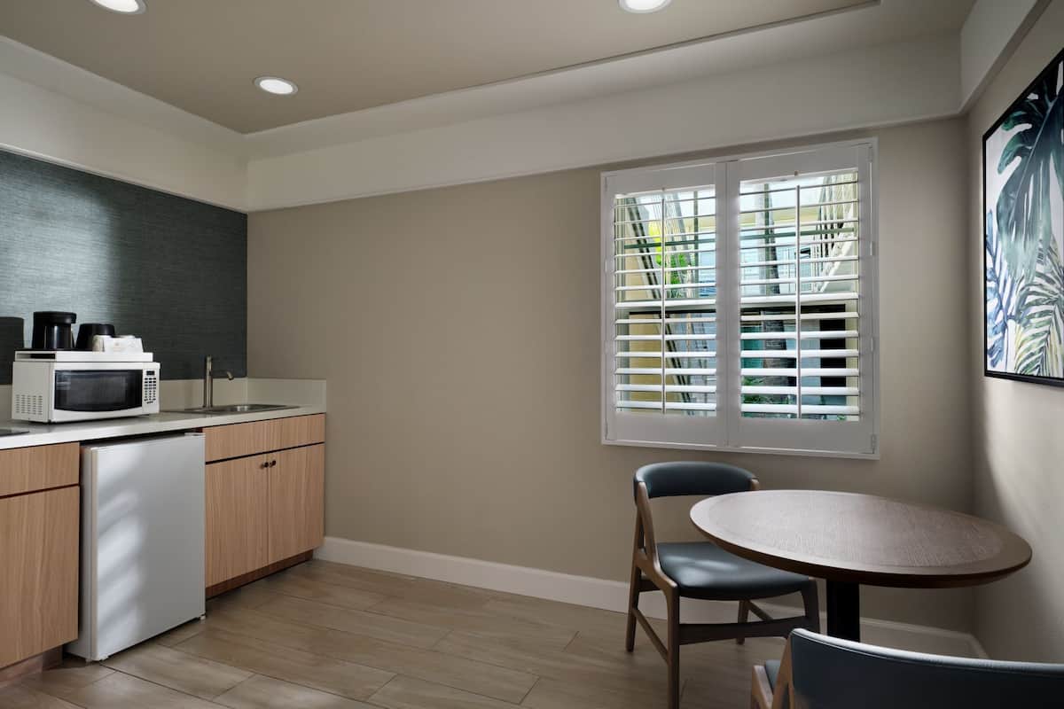 Mini-fridge, microwave, stovetop, coffee/tea maker