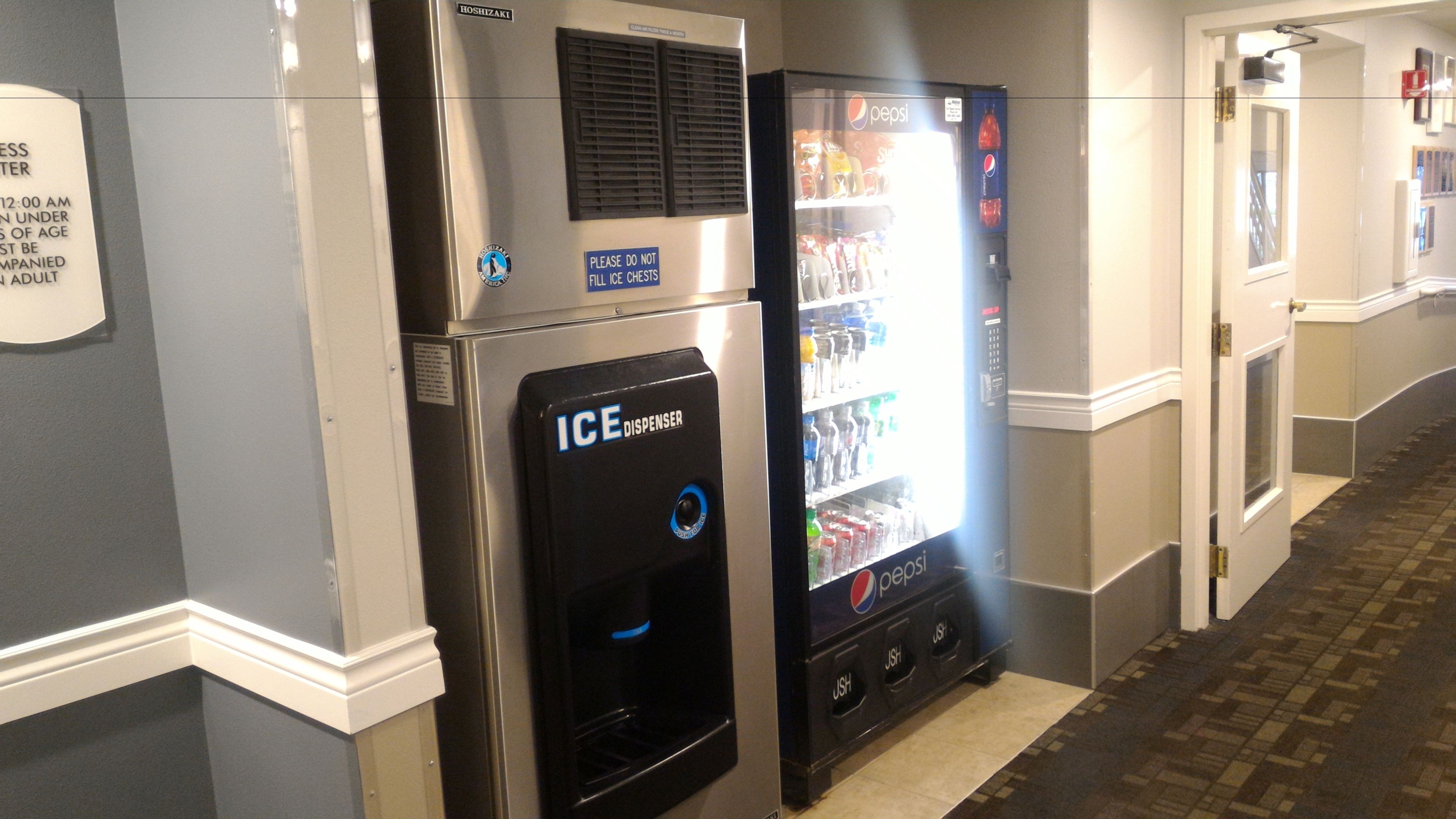 A vending machine with a Pepsi logo and an ice dispenser.
