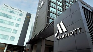 A modern building with a prominent 'Marriott' sign and a 'The Tennessean' sign on the side.