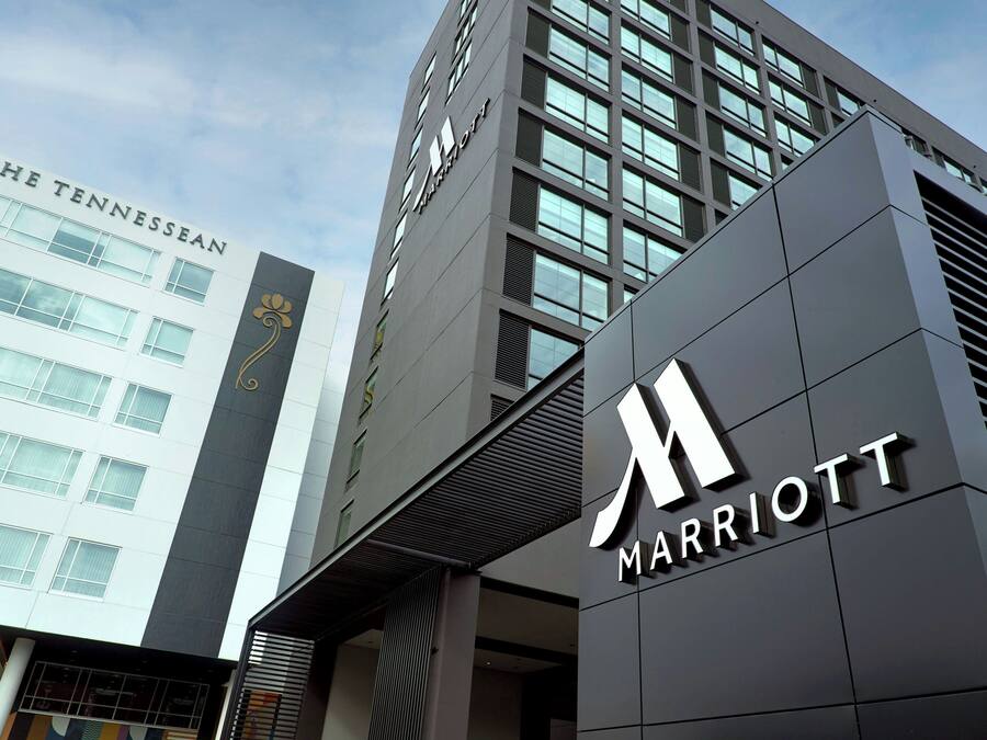 A modern building with a prominent 'Marriott' sign and a 'The Tennessean' sign on the side.