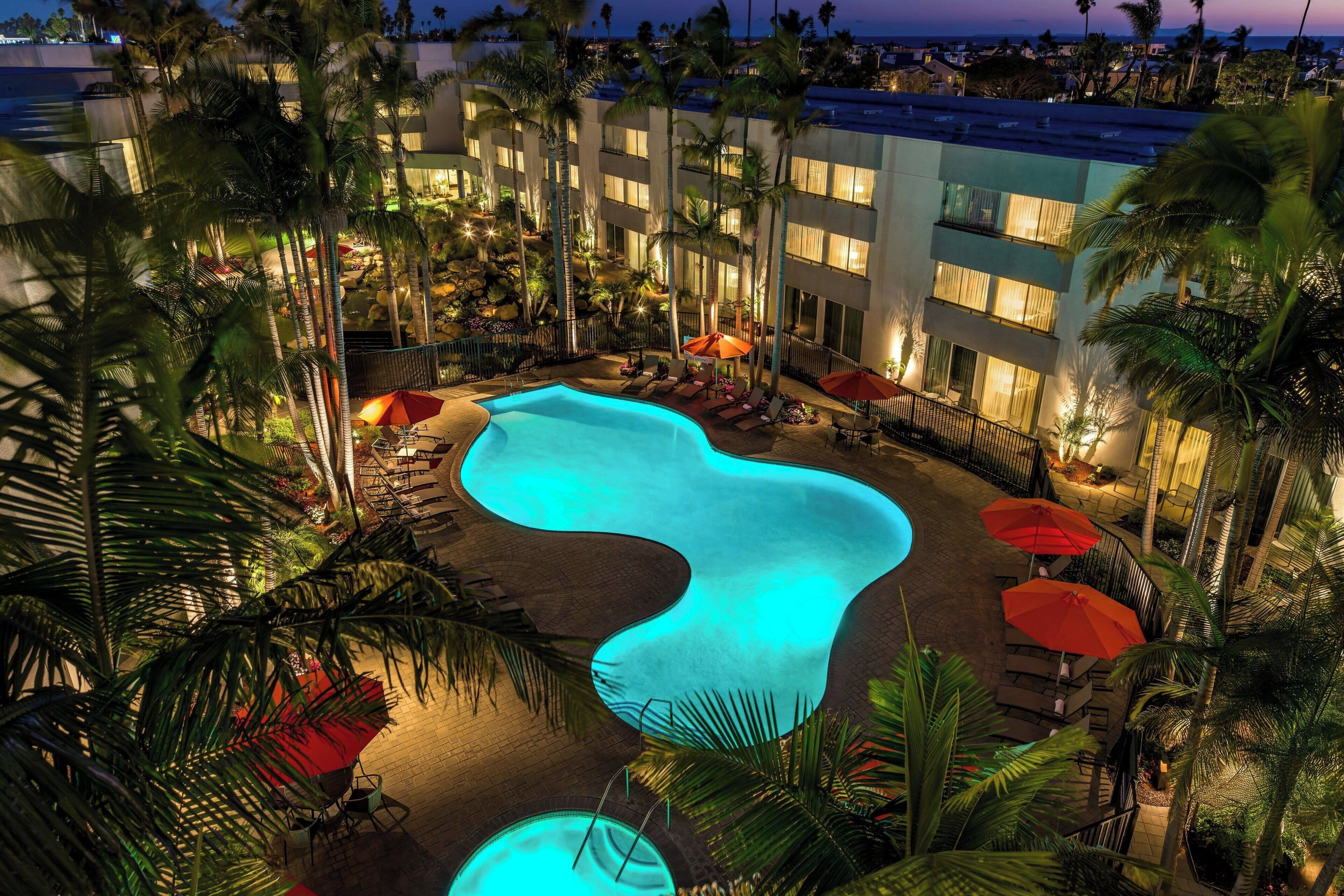 Outdoor pool, open 7 AM to 11:00 PM, pool umbrellas, sun loungers