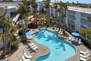 Outdoor pool, open 7 AM to 11:00 PM, pool umbrellas, pool loungers