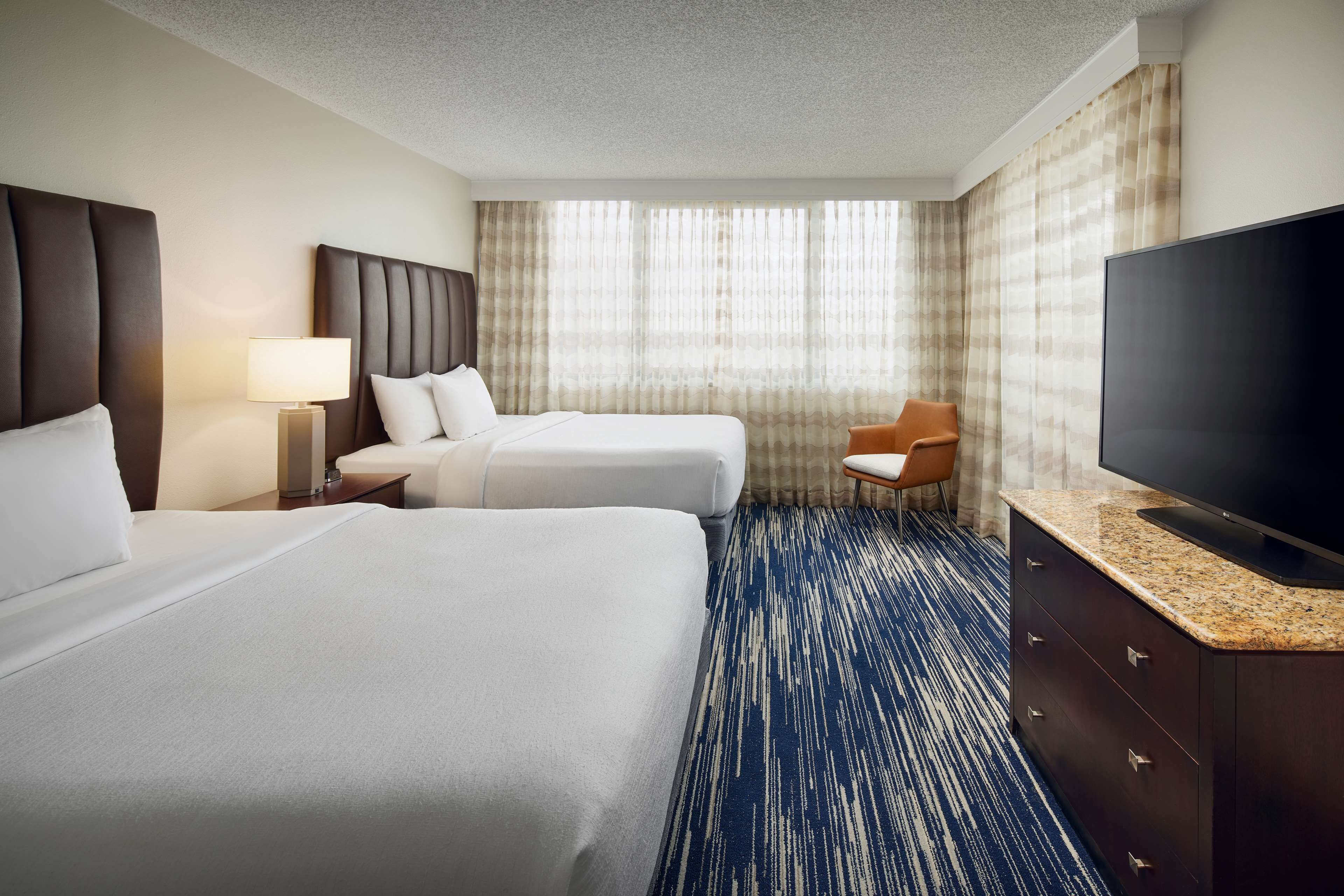 suite, 2 queen beds, non smoking, balcony | premium bedding, in-room safe, desk, laptop workspace