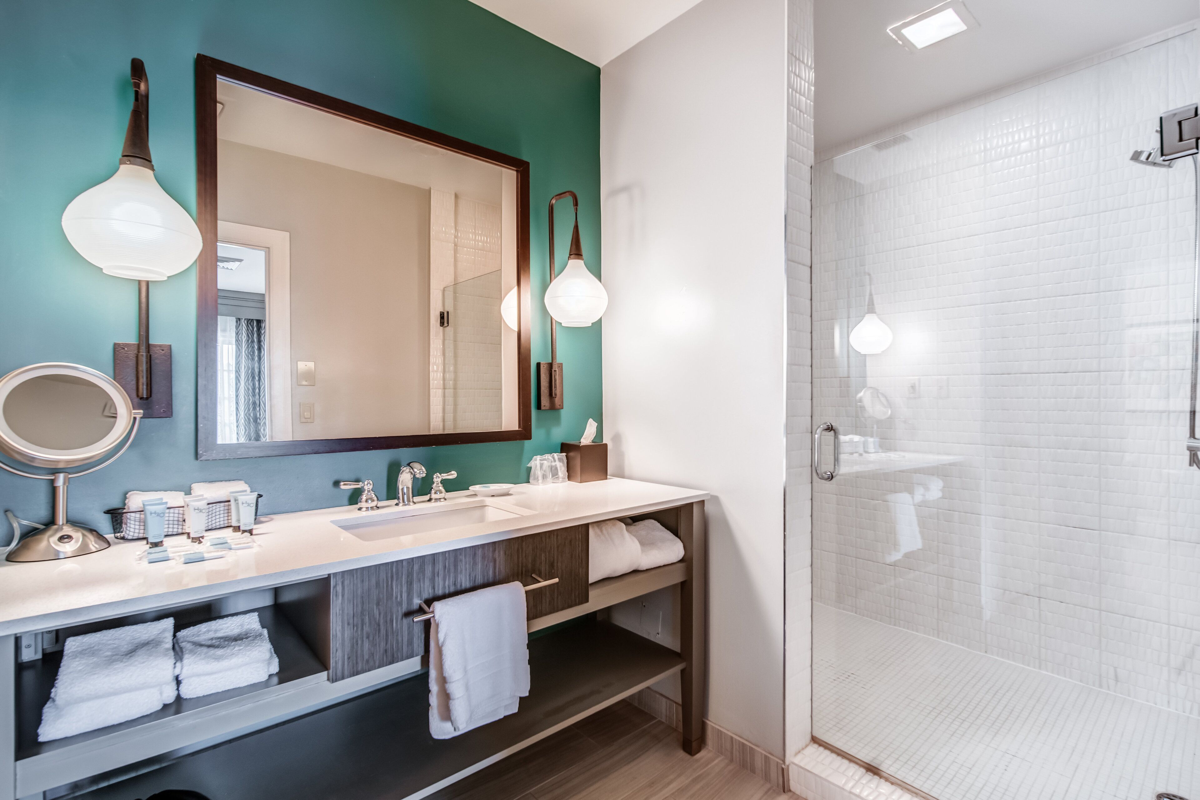 shower, designer toiletries, hair dryer, towels