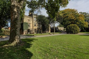 A historic building with a stone facade, large windows, and a well-maintained lawn. - Mosborough Hall Hotel, BW Signature Collection (Sheffield)