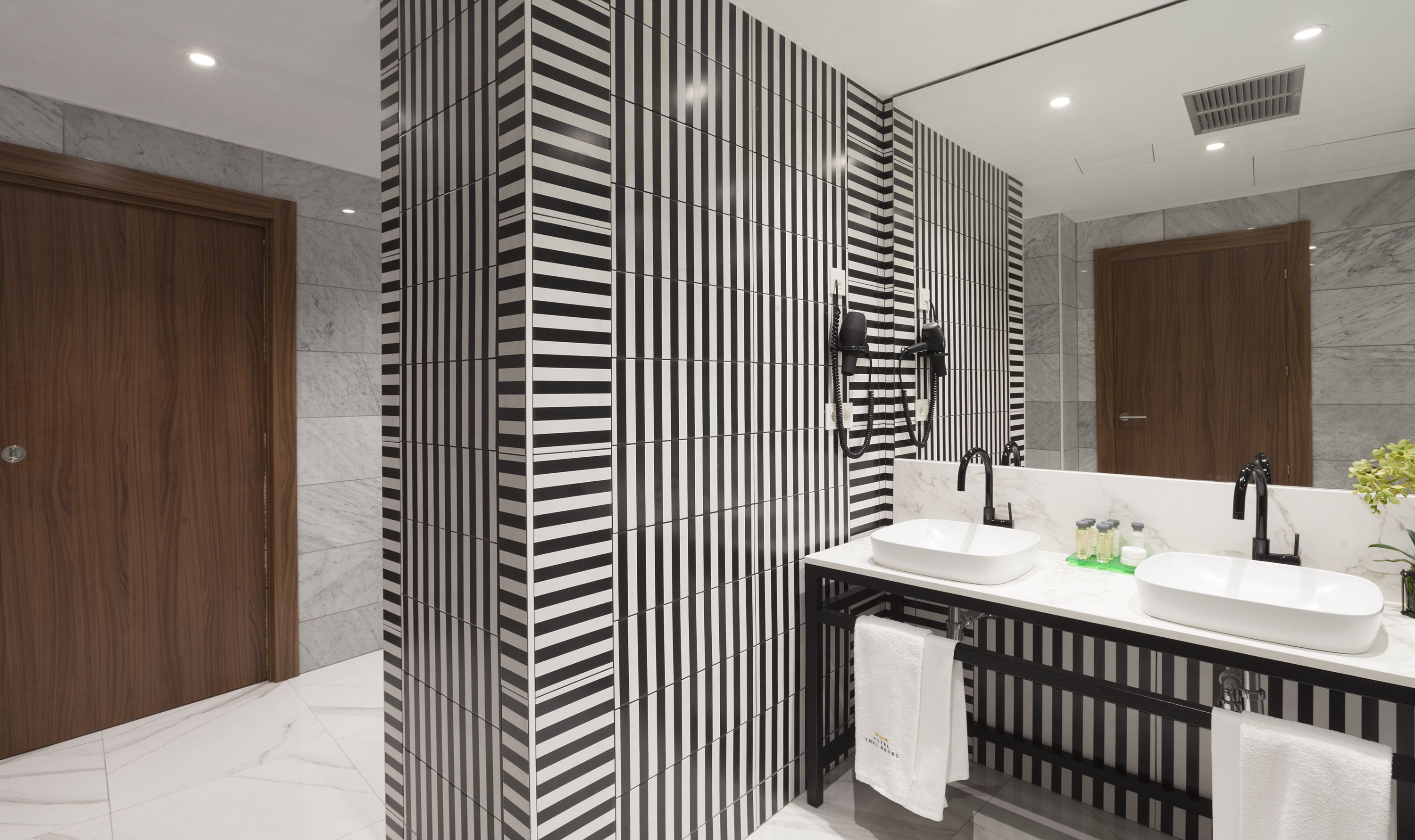 eco-friendly toiletries, hair dryer, towels