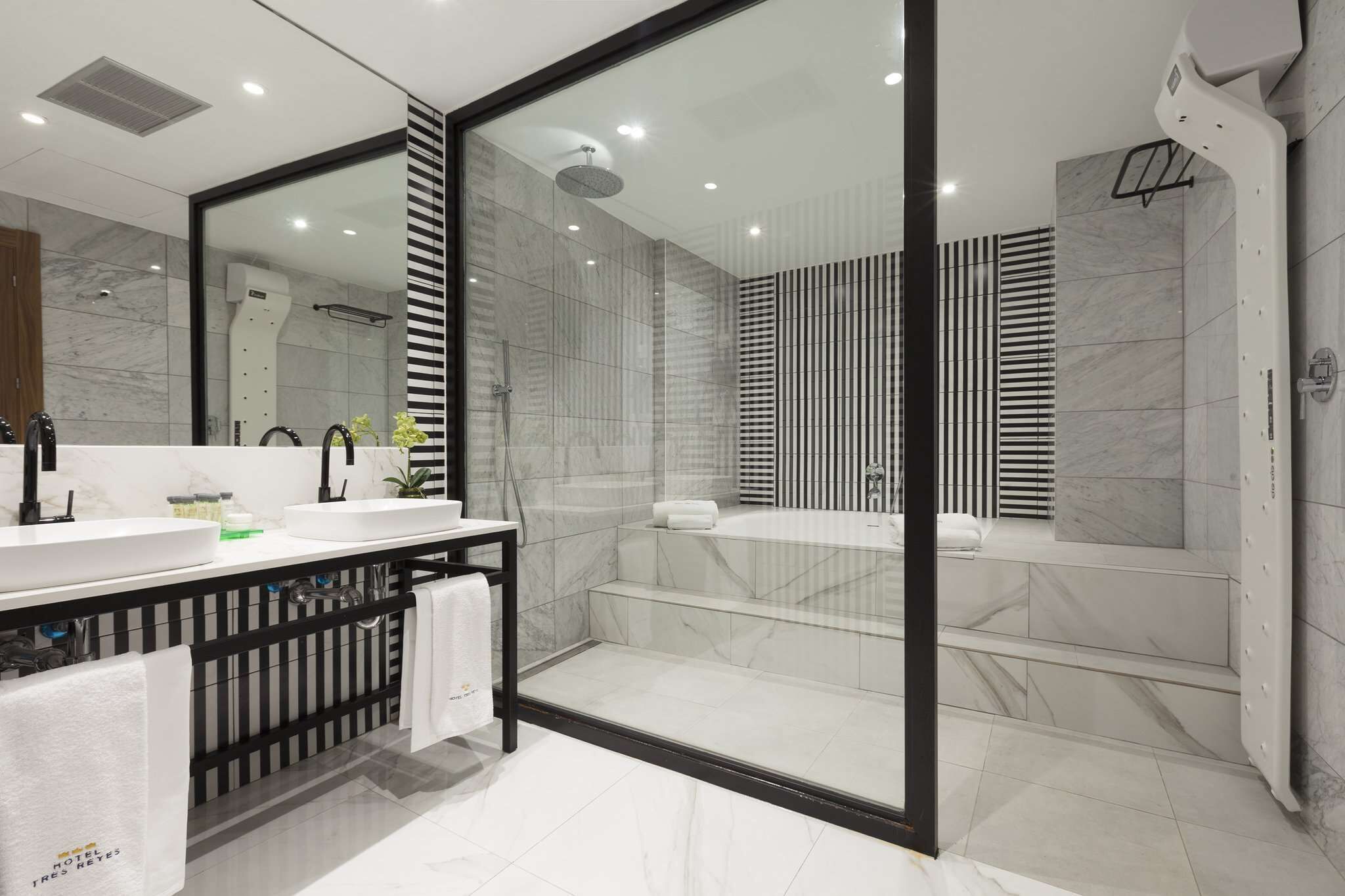 eco-friendly toiletries, hair dryer, towels