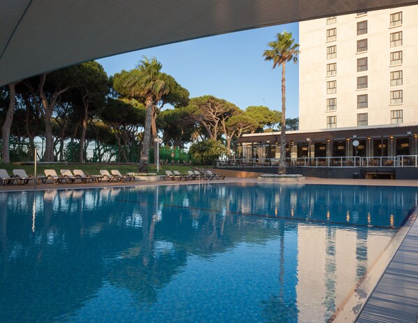 Seasonal outdoor pool, pool loungers