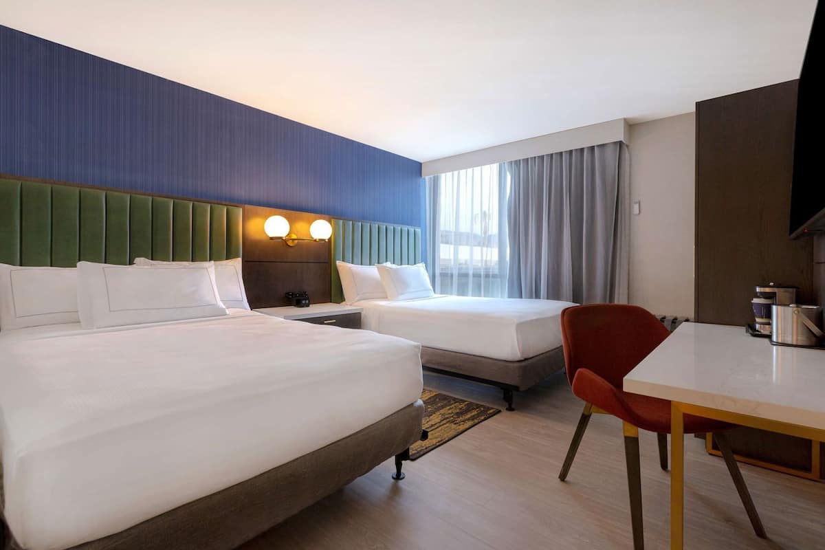 Down comforters, pillowtop beds, in-room safe, desk
