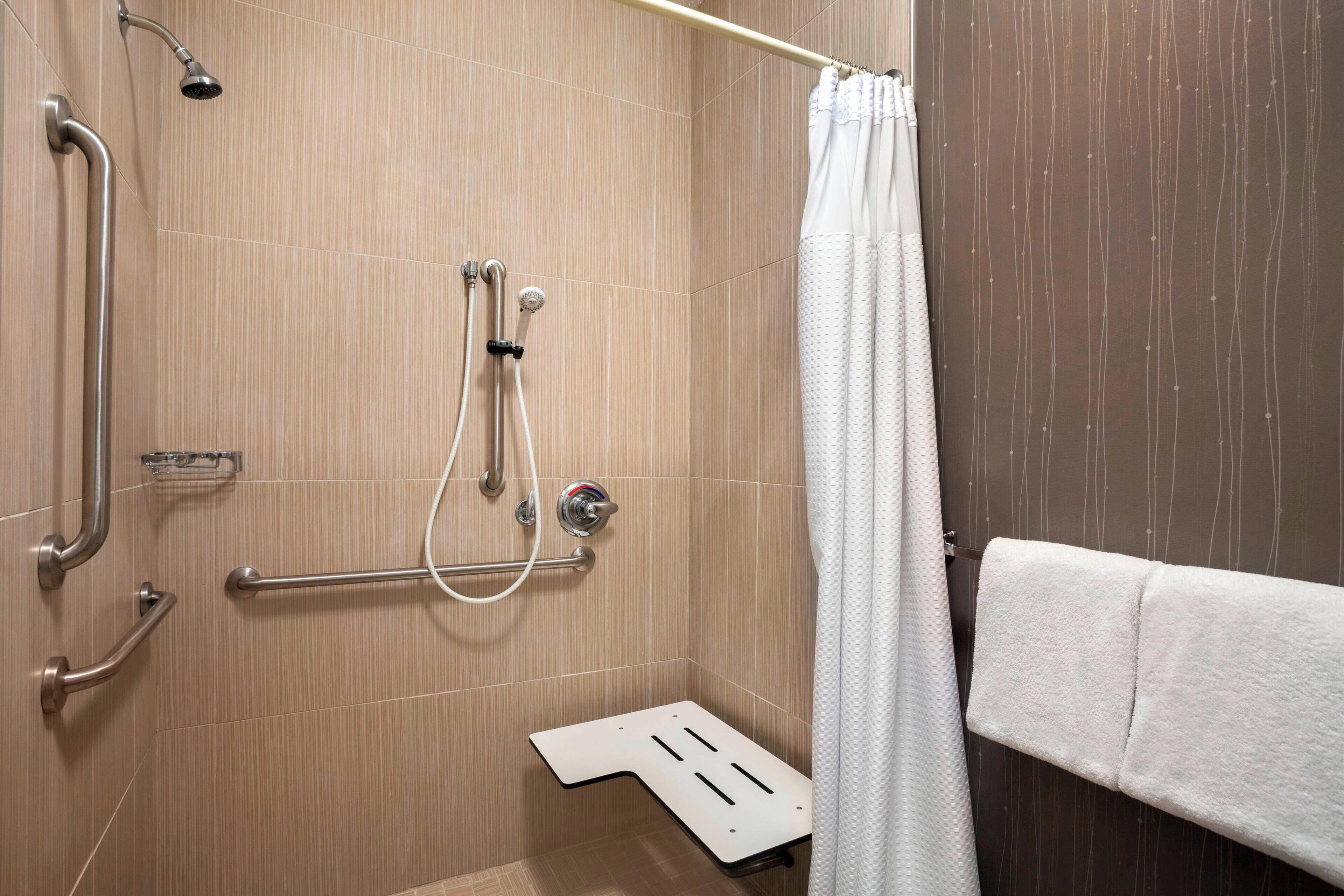 room, 2 queen beds, non smoking | bathroom | combined shower/bathtub, eco-friendly toiletries, hair dryer, towels