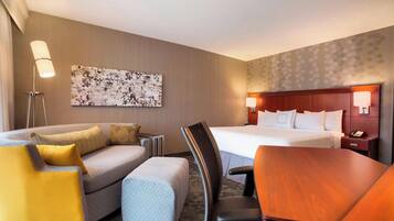 Premium bedding, desk, laptop workspace, iron/ironing board