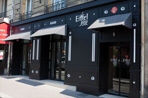 A hotel facade with the name 'Eiffel Jeine' and a number '3' on the door. - Hotel Eiffel Seine (Paris)